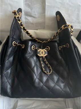 CHANEL Black Quilted Leather Drawstring Shoulder Bag with Gold Hardware